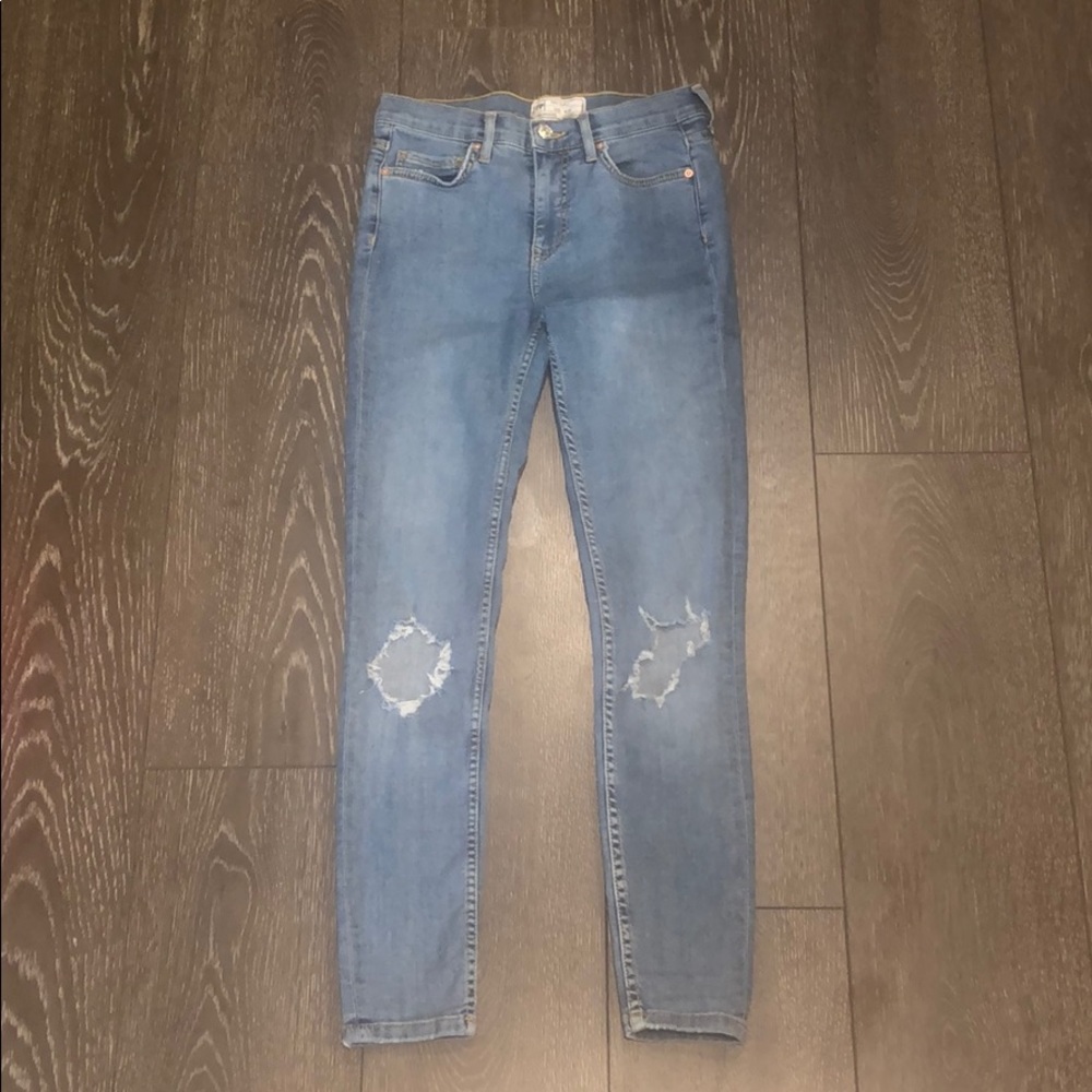 Free people size 25 blue skinny jean with holes